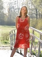 Dirty blonde hair and large breasts for this model as she goes outside and wears her see through dress.